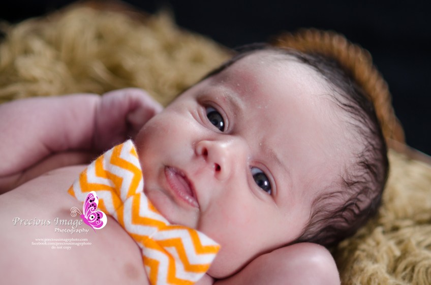 baby boy in an orange bow tie