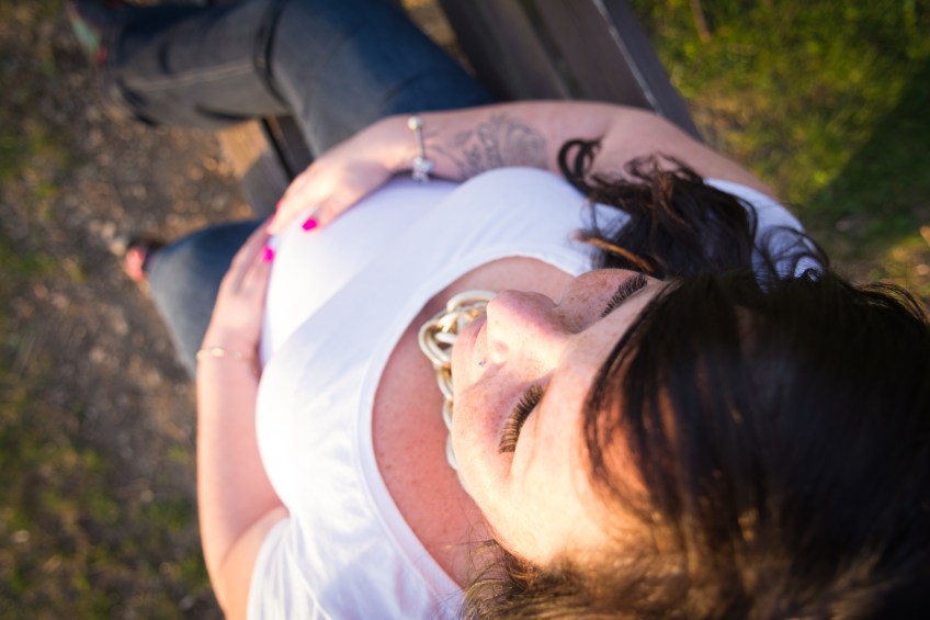 high angle of mom and her baby bump