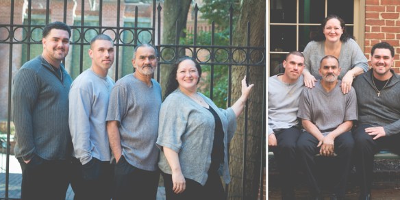 family standing in front of iron gate