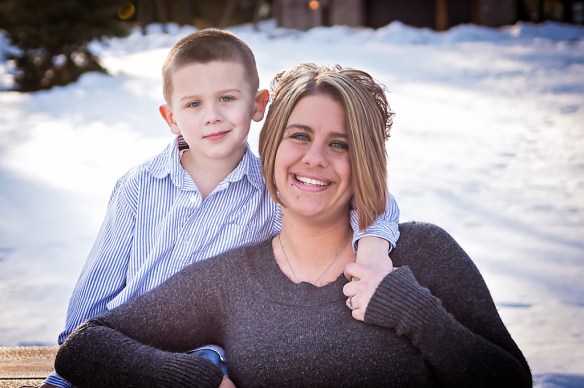 mom and son sitting on a bench